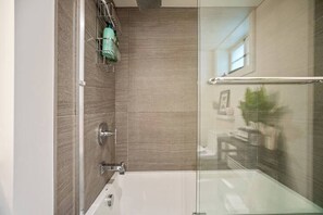 Shower, hair dryer, towels, shampoo