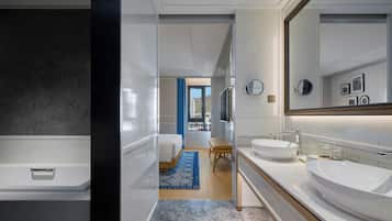 Suite, 1 King Bed (Centric) | Bathroom | Hair dryer, bathrobes, slippers, towels