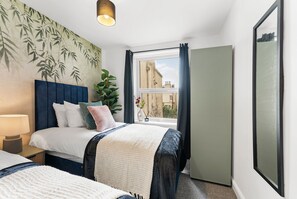 3 slaapkamers, een strijkplank/strijkijzer, beddengoed