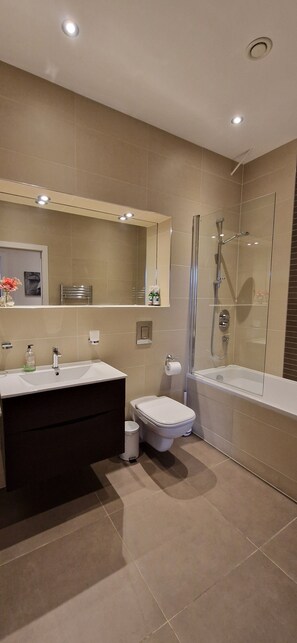 Shower, hair dryer, towels, soap