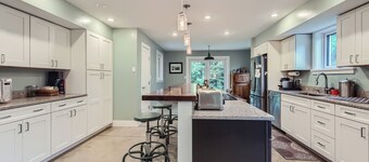 Spacious, modern 4-BR house in serene wooded setting just minutes from downtown