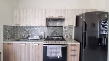 Fridge, coffee/tea maker, cookware/dishes/utensils