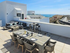 A rooftop terrace with a dining area, seating, and a view of the sea. - Penthouse with 2 large terraces and a Plunge Pool (La Cala de Mijas)
