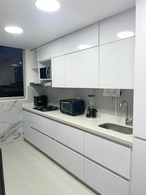 Microwave, coffee/tea maker, cookware/dishes/utensils, lobster pot