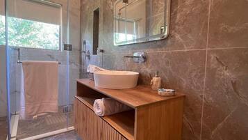 Luxury Chalet, Lake View | Bathroom | Shower, slippers, soap, shampoo