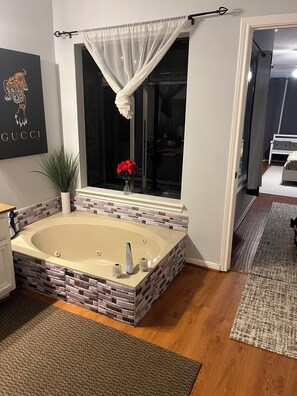 Jetted bath, towels, soap, toilet paper