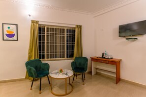 Standard Room | Desk, blackout drapes, iron/ironing board, bed sheets - Treebo Regalia Comforts, 5 mins to Raja Seat Garden (Madikeri)