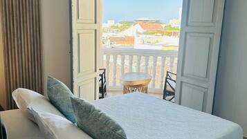 Family Room, Balcony | Minibar, free WiFi, bed sheets
