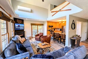 Smart TV, fireplace, table football, books