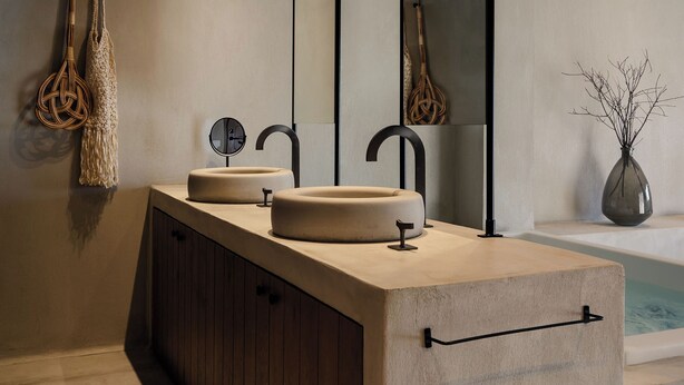 A modern bathroom with a large sink, two mirrors, and a wooden cabinet. - Tesoro Elegant escapes-suites (Naxos)