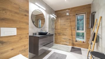 Shower, hair dryer, towels, soap