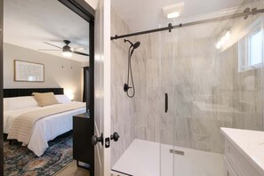 Shower, hair dryer, towels, shampoo