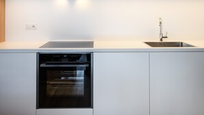 A modern kitchen with built-in appliances, a sink, and a dishwasher. - Apartment 'Apartments Emilia 3' with Mountain View, Balcony and Wi-Fi (Ortisei)