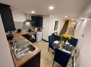 Fridge, microwave, oven, cookware/dishes/utensils