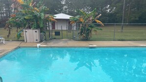 A rectangular swimming pool with clear blue water, surrounded by a concrete deck. - Redfish at Eufaula, AL (Eufaula)