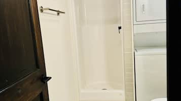 Shower, towels, soap, toilet paper