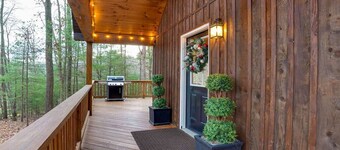 A charming cottage surrounded by woods, with your own private hot tub and outdoor fire pit, perfect for relaxing and enjoying the nature around you.