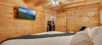 A charming cottage surrounded by woods, with your own private hot tub and outdoor fire pit, perfect for relaxing and enjoying the nature around you.