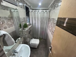 A bathroom with a shower, toilet, and sink. - The Imperial Hotel & Restaurant By GRB (Darbhanga)