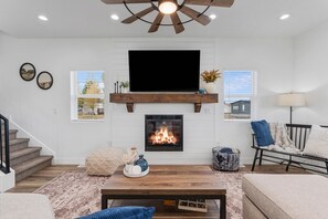 Smart TV, fireplace, books, offices