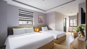 Family Triple Room, City View | Minibar, desk, laptop workspace, blackout drapes