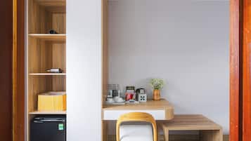 Deluxe Double Room | Living area | 35-inch TV with cable channels