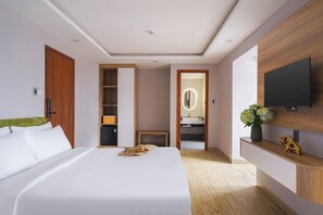 Family Triple Room, City View | Minibar, desk, laptop workspace, blackout curtains - Nature Hotel - Win Happy (Da Lat)