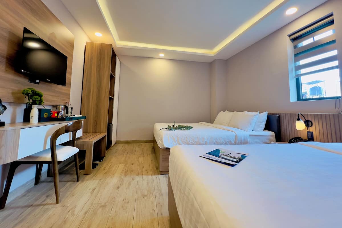 Triple Room, Courtyard View | Minibar, desk, laptop workspace, blackout drapes