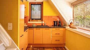 Fridge, highchair, dining tables