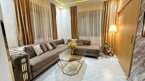 Family Apartment | Living area | 42-inch Smart TV with digital channels, streaming services - SHRTSTAYS - VENEZUELA APPARTS (Tangier)