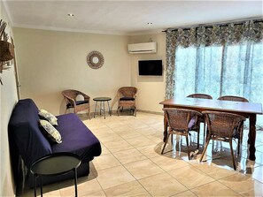 Interior - Charming 2nd Line Beach Apartment with Terrace, A/C, WiFi, and Community Parking (Roses)