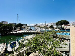 Marina - Family Getaway: Bright Apt with Pool, Garden, A/C & Terrace, Near Beach, Sleeps 4 (Roses)