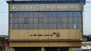 A building with a sign reading "TRIDEV RESTAURANT & BANQUET HALL". - Tridev Restaurant By GRB (Muzaffarpur)