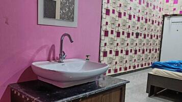 Deluxe Room, Balcony, City View | Desk, bed sheets