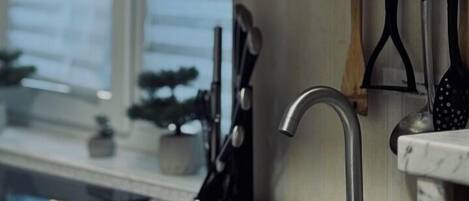 Mini-fridge, microwave, stovetop, cookware/dishes/utensils