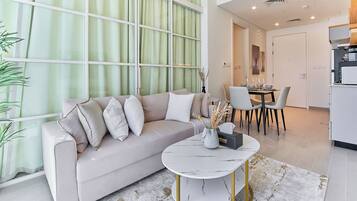 Standard Apartment, 1 Bedroom, Balcony | Living area | Flat-screen TV