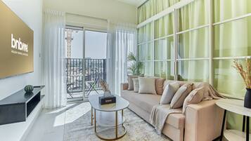 Standard Apartment, 1 Bedroom, Balcony | Living area | Flat-screen TV