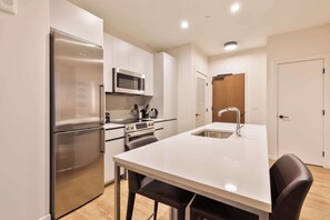 Fridge, microwave, oven, stovetop - Luxury Apt Heart of Seaport with Gym (Boston MA)