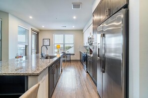 Fridge, dining tables - Landing | Stylish 2BD, Clubhouse, Pool (McKinney)