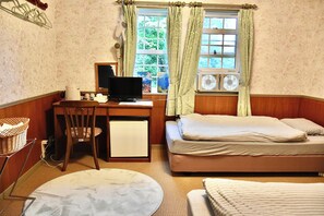 A room with a wooden desk, a computer, a chair, a small refrigerator, a bed with a mattress, and a window with curtains. - Echoland Madarao  (Myoko)