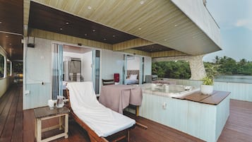 Relax on the deck with a hot tub and scenic views of the water.