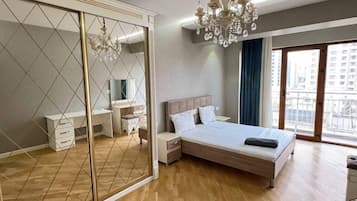 Deluxe Condo, City View | Premium bedding, desk, laptop workspace, soundproofing