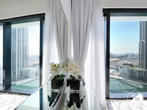 Enjoy breathtaking city views from the comfort of your room, with a panoramic view of the cityscape through large windows.
