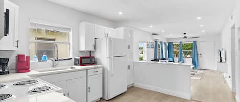 Fridge, microwave, stovetop, coffee/tea maker