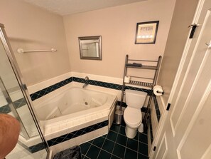 Shower, jetted bath, towels, soap