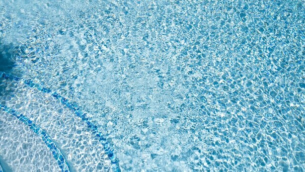A clear view of a swimming pool's edge with a tiled pattern. - CTBH @ Argyle #3 [1-Bedroom w/ Pool] (Kingston)