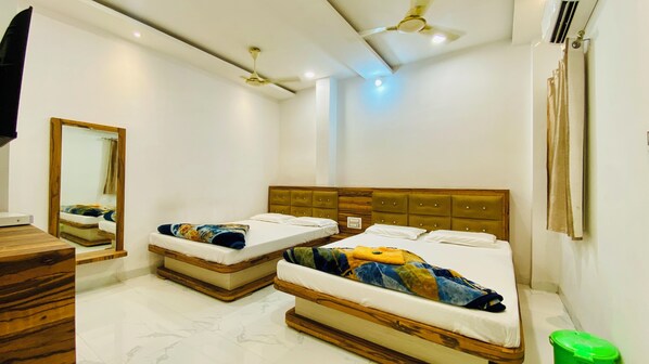 Chambre quadruple Deluxe | Accès au Wi-Fi (inclus), literie fournie