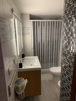 Hair dryer, bidet, towels, soap