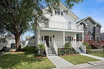 Front of home; unit is in back behind the oak tree