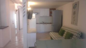 Appart'hôtel Familial, patio, rez-de-chaussée | Coin séjour